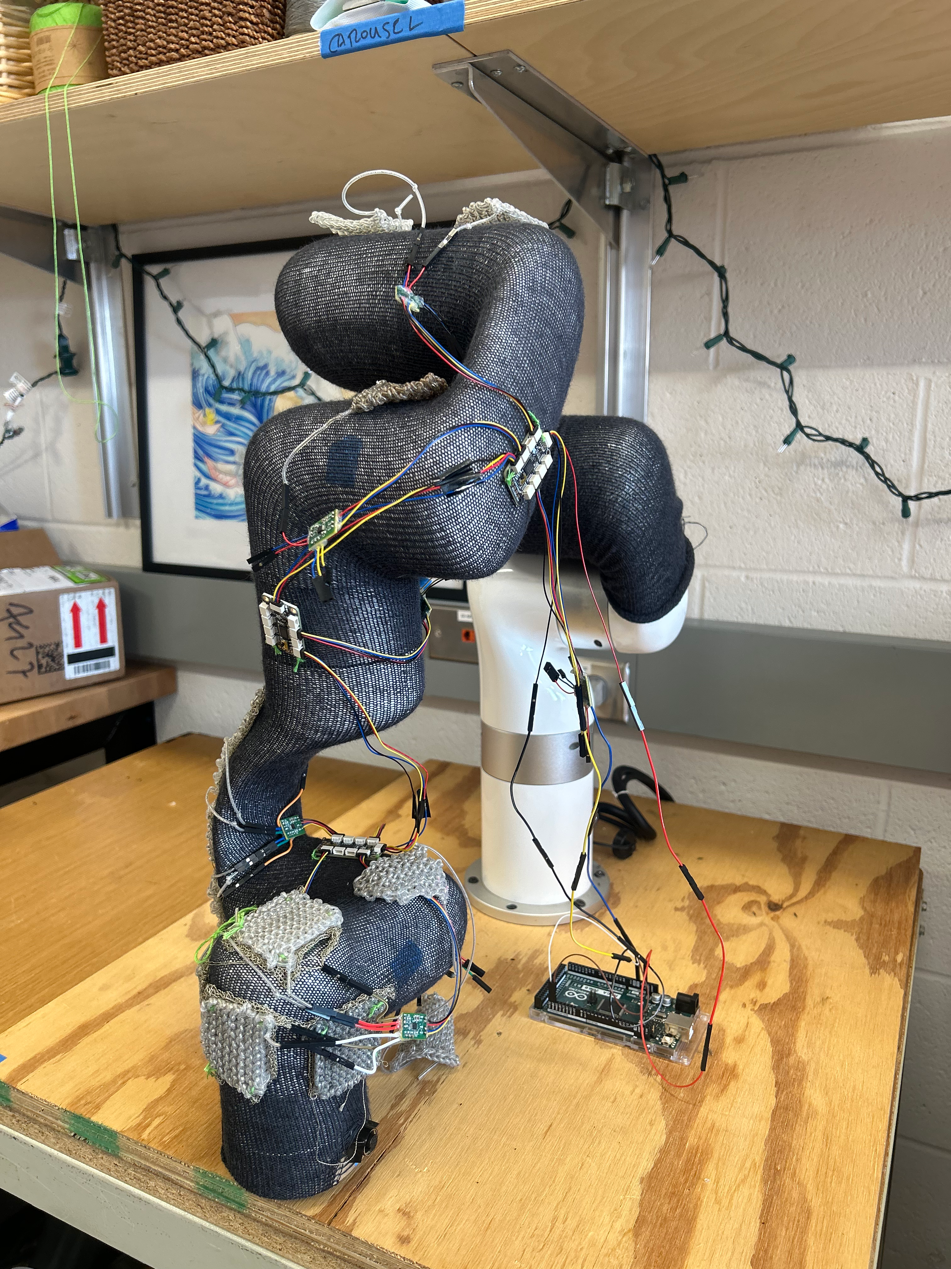 Robot arm fitted with sleeve.